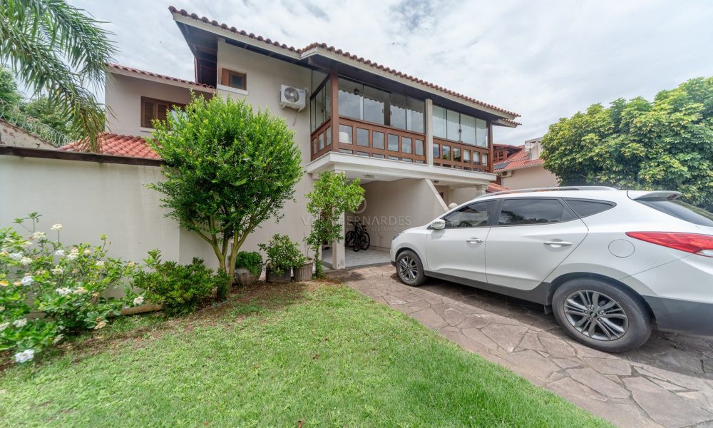 Casa em Condomínio à venda com 3 dormitórios, 400m² e 2 vagas no bairro Cavalhada, Zona Sul de Porto Alegre - 001