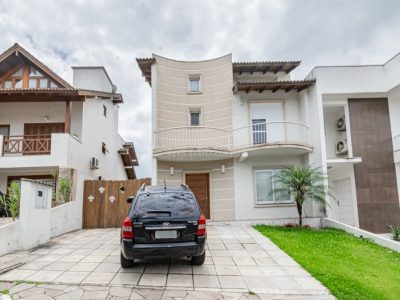 Casa em Condomínio à venda com 3 dormitórios, 255m² e 2 vagas no bairro Hípica, Zona Sul de Porto Alegre