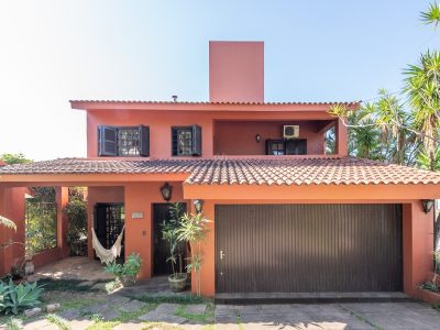 Casa à venda com 4 dormitórios, 250m² e 2 vagas no bairro Jardim Isabel, Zona Sul de Porto Alegre