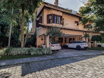 Casa em Condomínio à venda com 4 dormitórios, 400m² e 3 vagas no bairro Tristeza, Zona Sul de Porto Alegre