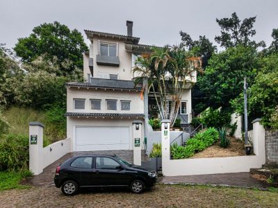 Casa em Condomínio à venda com 4 dormitórios, 322m² e 2 vagas no bairro Nonoai, Zona Sul de Porto Alegre