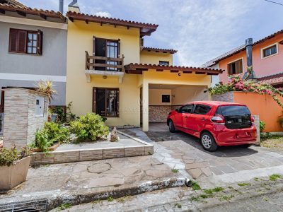 Casa em Condomínio à venda com 3 dormitórios, 155m² e 2 vagas no bairro Guarujá, Zona Sul de Porto Alegre