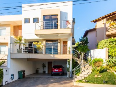 Casa em Condomínio à venda com 3 dormitórios, 270m² e 3 vagas no bairro Hípica, Zona Sul de Porto Alegre