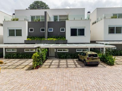 Casa em Condomínio à venda com 3 dormitórios, 438m² e 3 vagas no bairro Pedra Redonda, Zona Sul de Porto Alegre