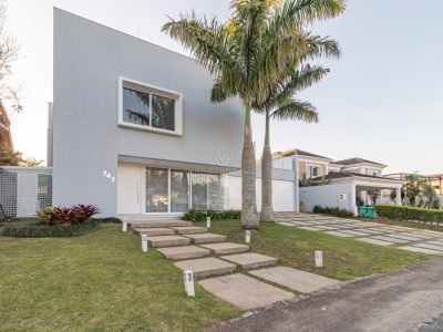 Casa em Condomínio à venda com 6 dormitórios, 711m² e 6 vagas no bairro Terra Ville, Zona Sul de Porto Alegre