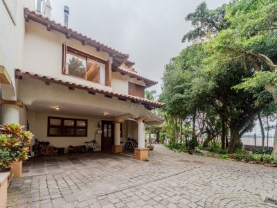 Casa em Condomínio à venda com 3 dormitórios, 300m² e 2 vagas no bairro Camaquã, Zona Sul de Porto Alegre