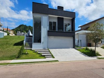 Casa em Condomínio à venda com 4 dormitórios, 297m² e 2 vagas no bairro Alphaville, Zona Sul de Porto Alegre