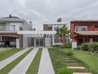 Casa em Condomínio à venda com 5 dormitórios, 310m² e 4 vagas no bairro Terra Ville, Zona Sul de Porto Alegre